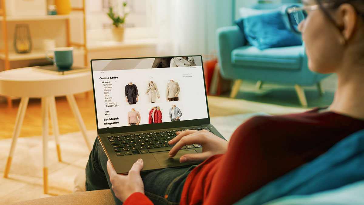 person on laptop doing online shopping as a digital mystery shopper